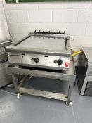 A Falcon stainless steel gas grill on stainless steel trolley stand CONDITION REPORT: