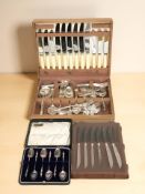 A canteen of stainless steel cutlery, further set of apostle spoons and a set of knives.