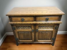 An oak Jaycee linen fold sideboard,