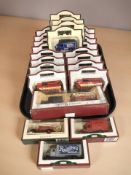 A collection of Days Gone boxed die cast delivery wagons, buses, etc.