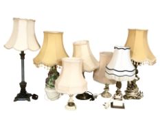 A group of contemporary table lamps with shades.