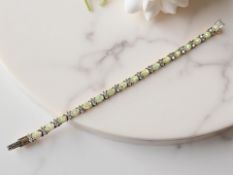 A silver and synthetic opal bracelet, length 19cm.
