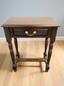 A reproduction mahogany single drawer side table,