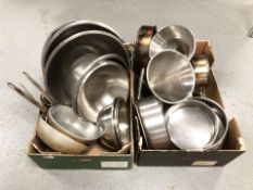 A large quantity stainless steel commercial cooking pans,