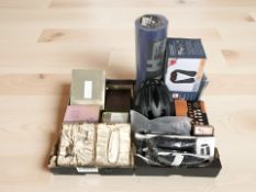 Miscellaneous items including camping mat, cycle helmet, digital wristwatch, cosmetics, etc.
