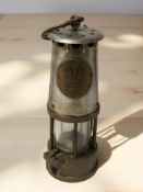An Eccles Protector Type 6 miner's safety lamp.