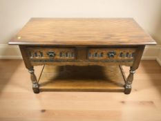 A Old Charm oak two drawer low table,