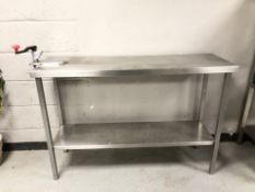 A stainless steel commercial two tier catering bench,