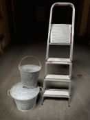 A galvanised twin handled tub, further bucket and an aluminium stepladder.