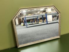 A reproduction gilt overmantle mirror,