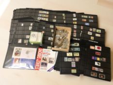 A collection of British and international stamps, pre-decimal coins, etc.