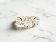 A 9ct gold triple-cluster dress ring, size T CONDITION REPORT: 2.