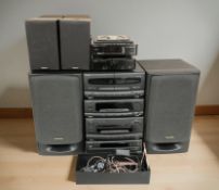 A Technics hi/fi system with speakers and a Hitachi mini hi/fi system with speakers