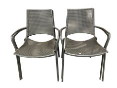 Four enamelled metal stackable outdoor armchairs