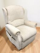 An electric reclining armchair