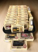 A collection of Lledo Days Gone boxed die cast delivery vans, buses, etc.