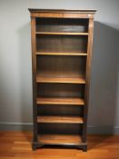 A reproduction mahogany open bookcase,