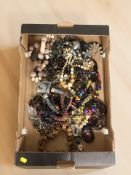 A collection of costume bead necklaces, pendants, etc.