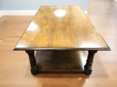 A reproduction oak rectangular two tier coffee table,