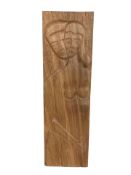 A carved wooden panel depicting lovers,