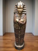 A highly decorative Egyptian style cabinet in the form of a 'Mummy' sarcophagus with shelved