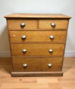 An early 20th century pine five drawer chest,