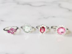 Four various silver dress rings,