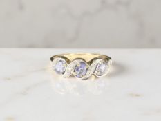 A 9ct gold tanzanite and diamond ring,