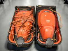 Two Flymo electric lawn mowers