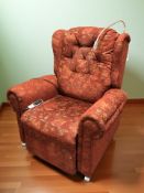 An electric reclining armchair