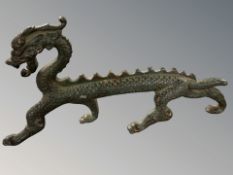 A reproduction patinated bronze figure of Chinese dragon, length 29 cm.