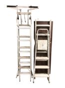A decorator's platform together with further aluminium ladders