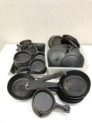 A quantity of Utopia cast iron skillets