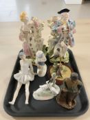 A pair of continental porcelain spill vases in the form of a lady and gentleman,