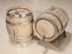 Two metal bound kegs, length 33 cm.