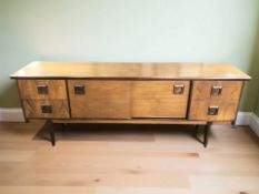 A 20th century teak low sideboard, 198 cm x 46 cm x 75 cm.