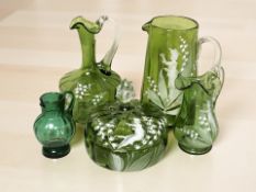 A group of Mary Gregory style green glass ware