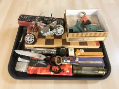 A chess board, torch, lighters, dominoes,