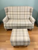 A modern two seater settee in tartan fabric, width 132 cm, and matching footstool.