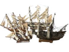 Four scale model battleships, tallest 53 cm.