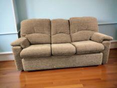 A contemporary three seater settee, length 213 cm, and matching armchair.