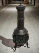 A metal patio wood burner, height 105 cm.