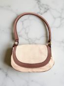 A Mulberry pink fabric bag with Burgundy leather edges and strap,