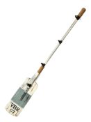 A painted coat rack in the form of an oar, length 110 cm.