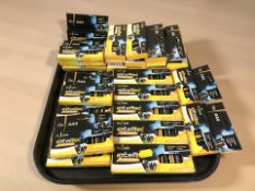 Approximately twenty eight packs of AA and AAA batteries.