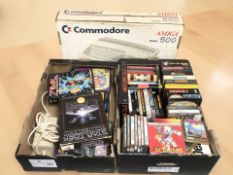 A Commodore Amiga 500 system, in original box, together with a quantity of games.