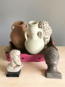 A group of pottery vessels, busts including Buddha.