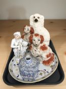 A pair of Staffordshire spaniels, a further larger example, figure of a musician, other ceramics.