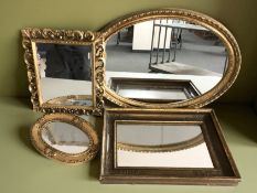 Four ornate gilt framed mirrors, largest 60 cm wide.