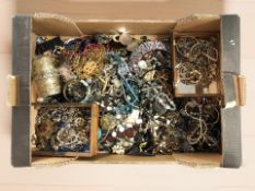 A large quantity of modern costume jewellery including bead necklaces, gilt metal chains, bangles,